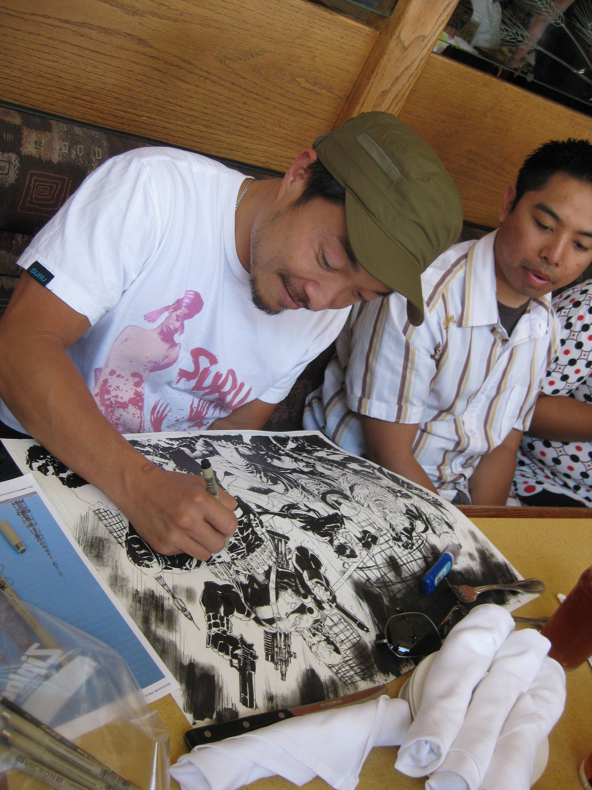 Jim Lee happily drawing the cover to Mayhem's TPB during lunch.