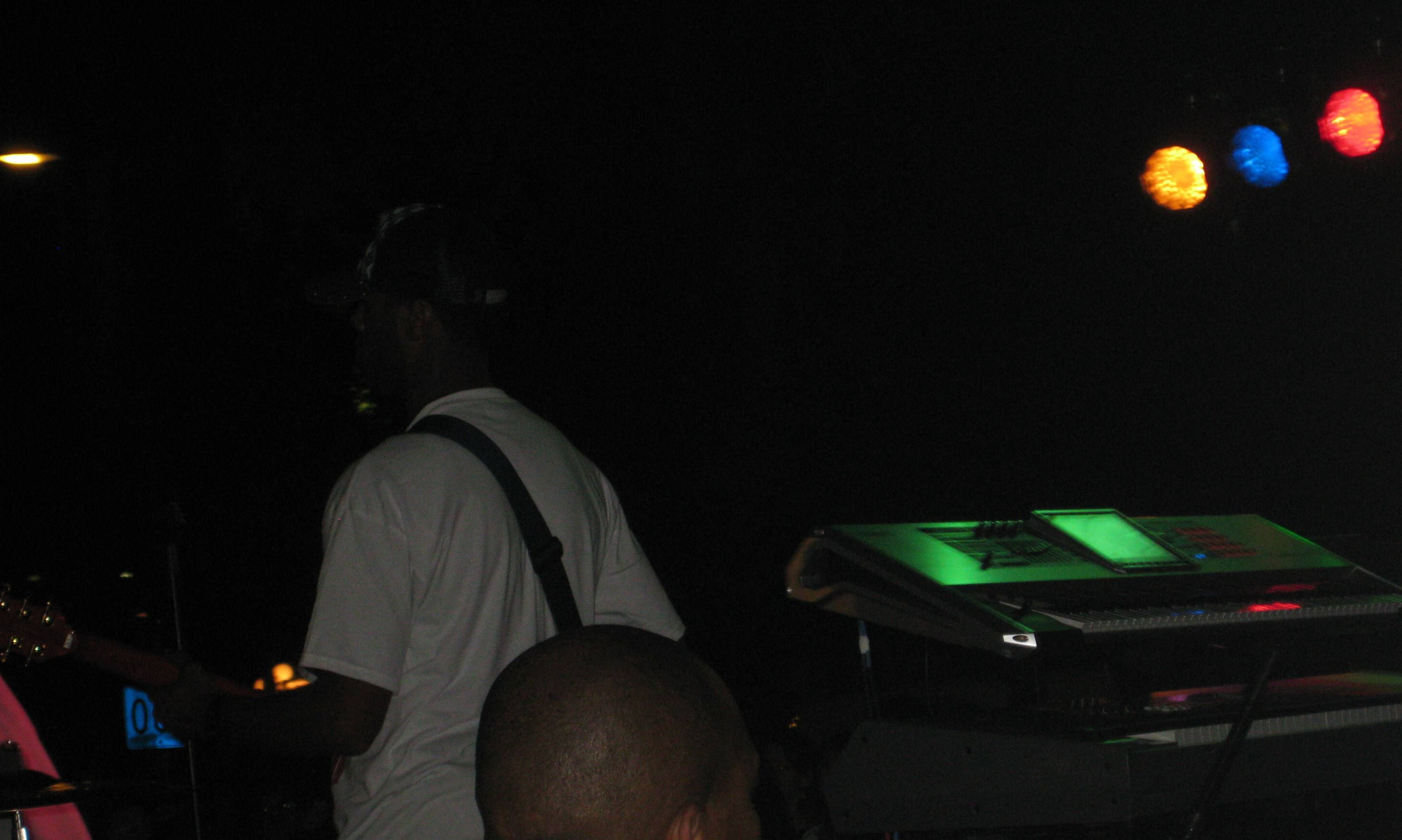 Live band set up with stage lights flood the backlot of Meltdown.