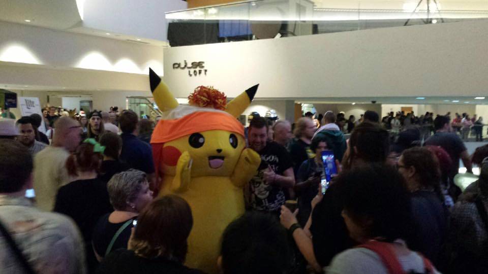 Pikachu takes some pictures with fans.