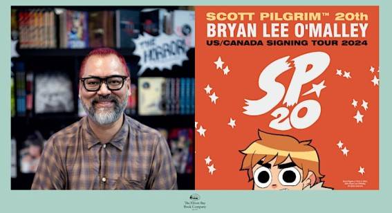 A man with glasses and a beard smiles beside a promotional poster for Scott Pilgrim's 20th anniversary signing tour by Bryan Lee O'Malley in the US and Canada in 2024.