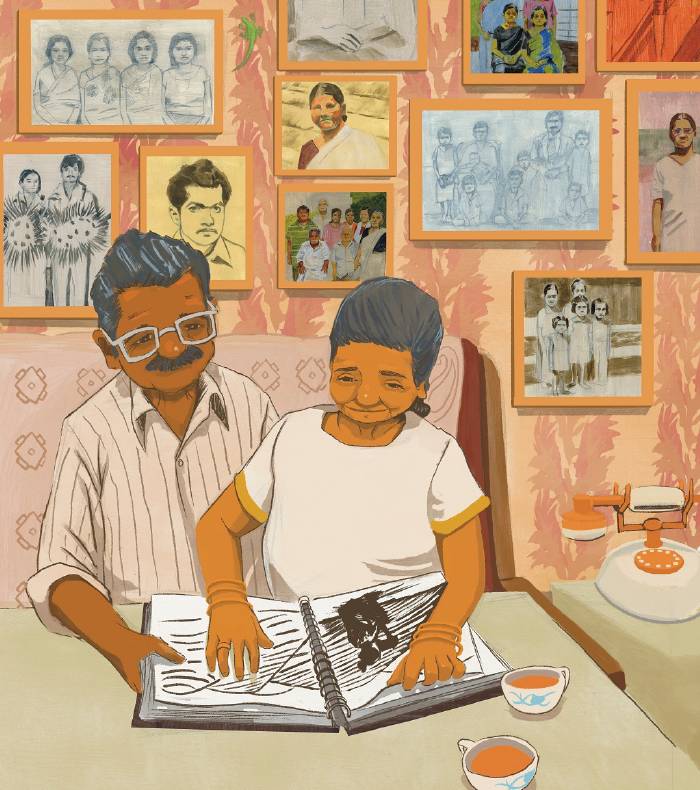 An elderly couple sits at a table looking through a photo album, with family photos and portraits displayed on the wall behind them. Two cups of tea and a rotary phone are on the table.