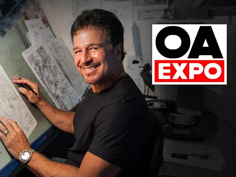 A man drawing at a desk with sketches, smiling at the camera; OA Expo logo is displayed in the upper right corner.