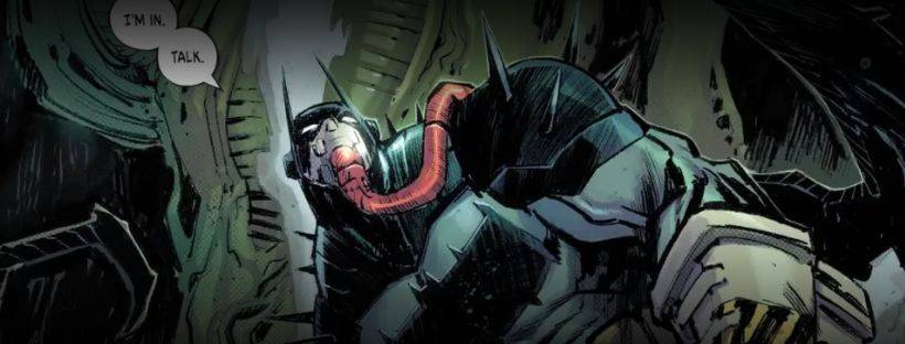 A comic book character in a mask and armored suit is connected to a tube, with a speech bubble saying "I'M IN. TALK." The background features mechanical elements.