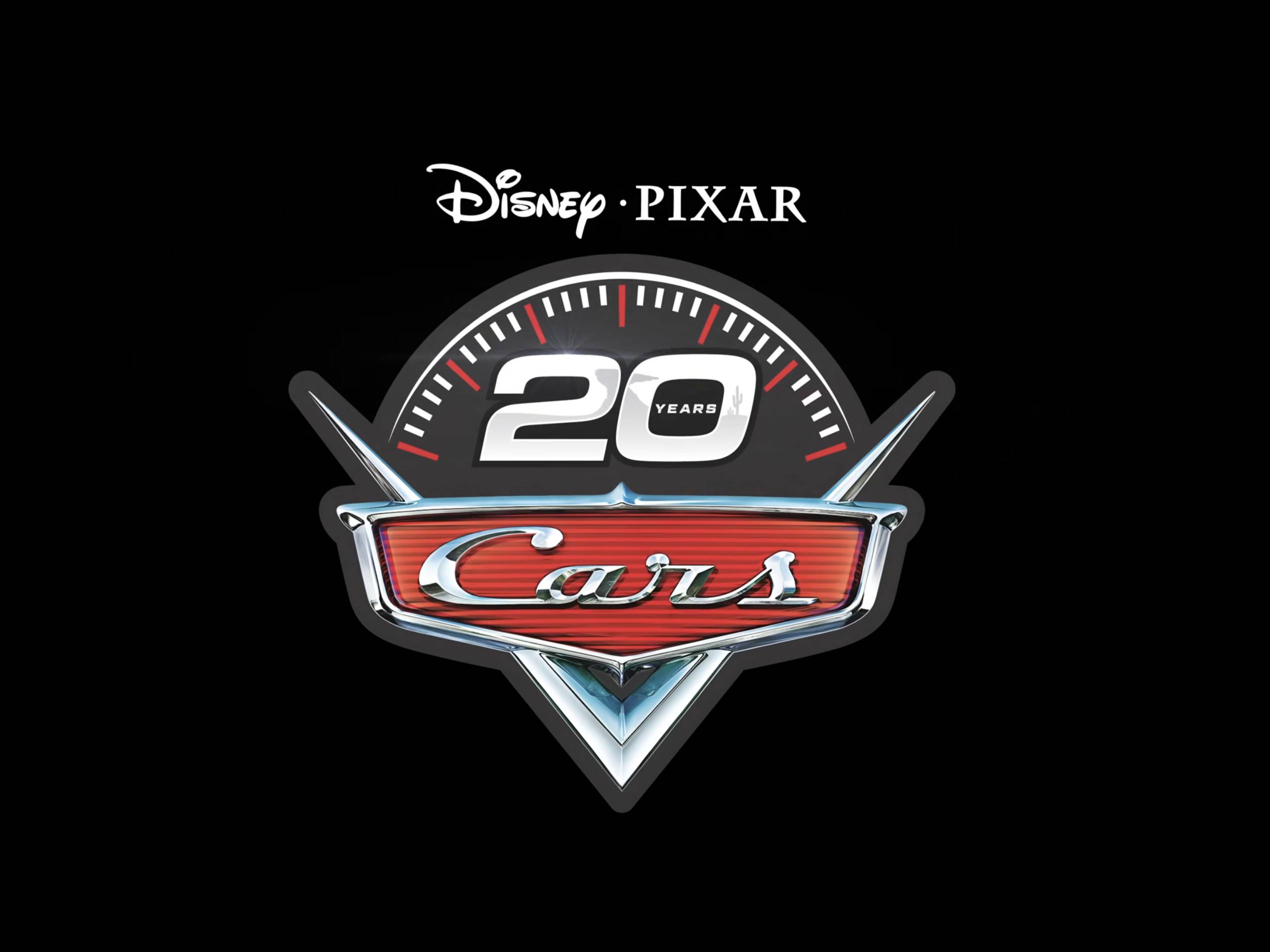 Disney Pixar "Cars" 20th anniversary logo featuring a speedometer and the word "Cars" on a red grille emblem, set against a black background.