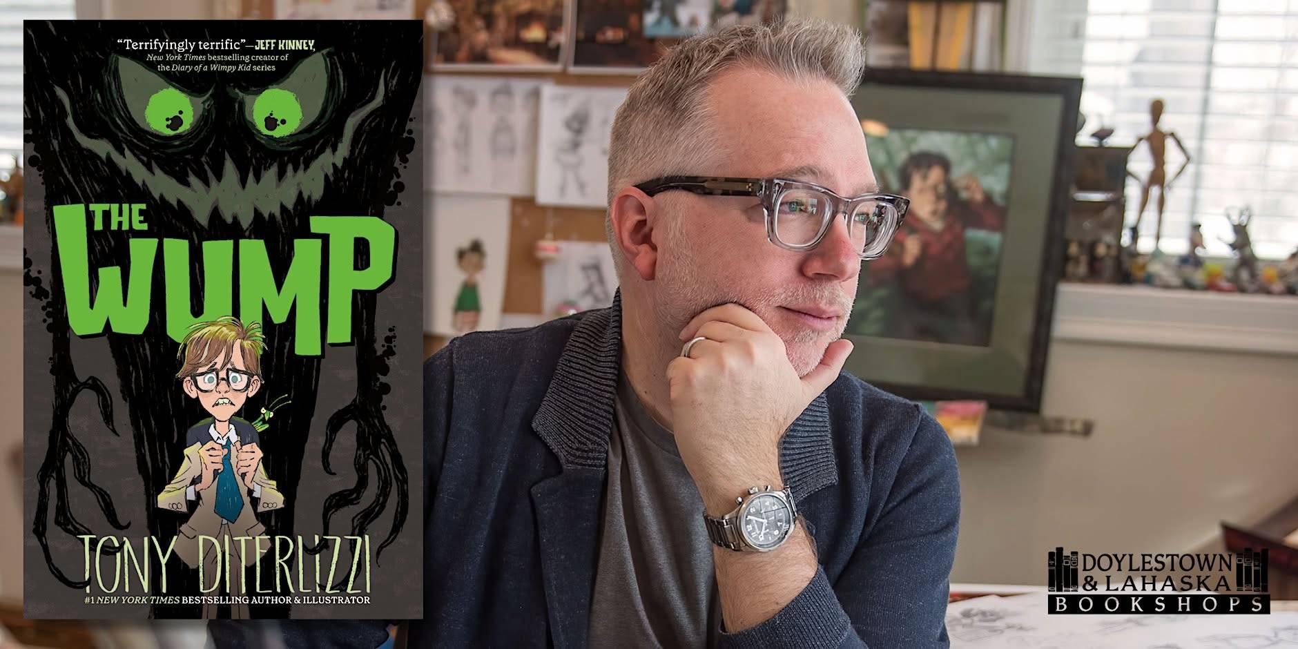 A man sits at a desk with art supplies, looking to the side. To the left is the cover of the book “The Wump” by Tony DiTerlizzi. The Doylestown & Lahaska Bookshops logo is in the corner.